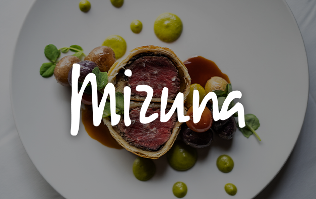 Mizuna Logo over a plate of beef wellington