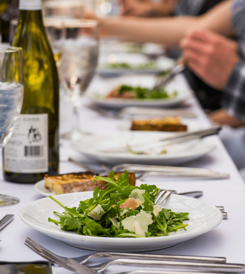 Set table with a salad in focus.